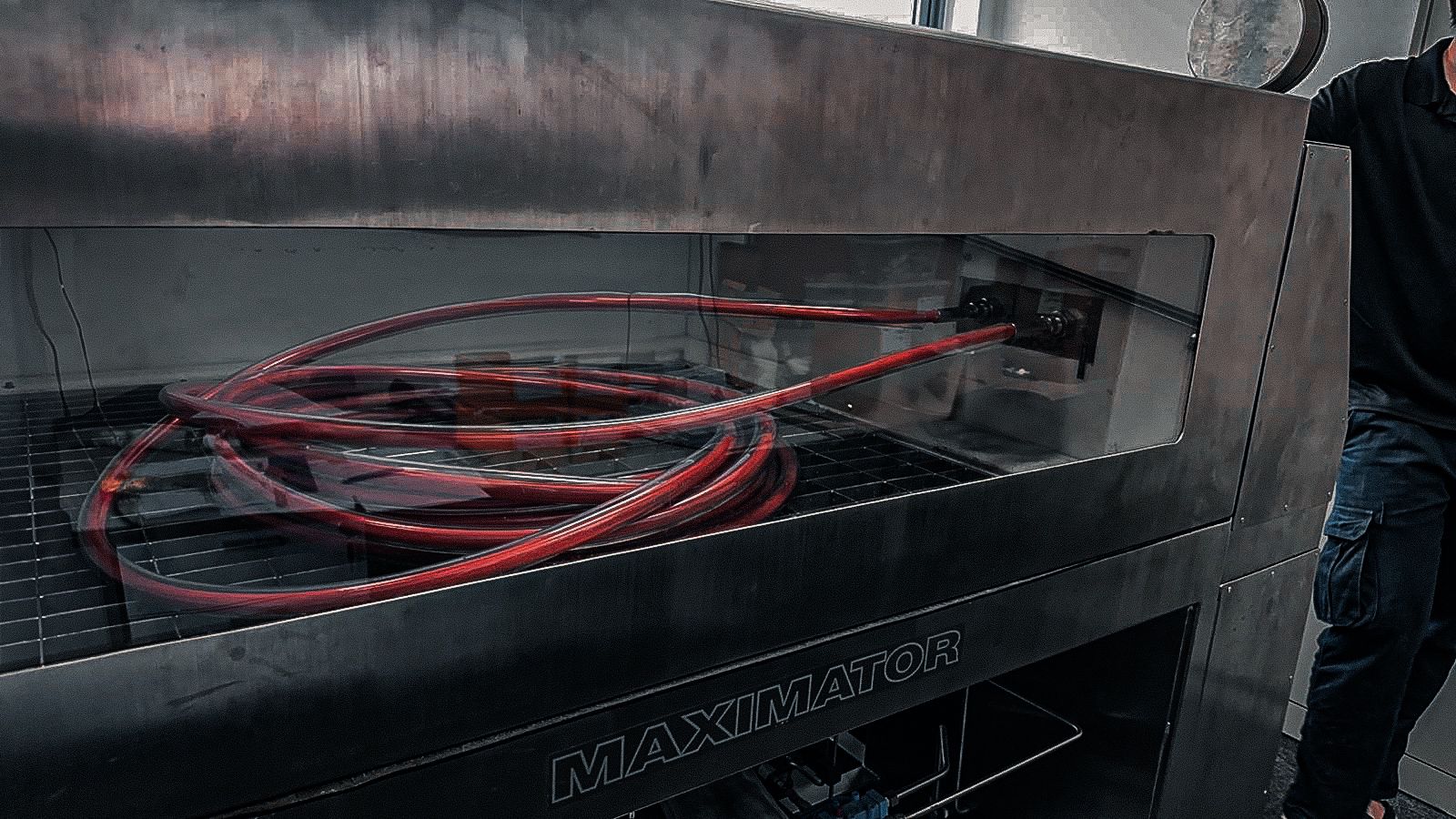 Technician performing equipment testing at SG Dynamics Pte Ltd facility in Singapore.